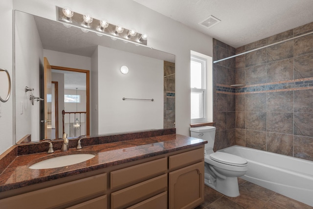 full bathroom featuring toilet, visible vents, vanity, and shower / bathing tub combination