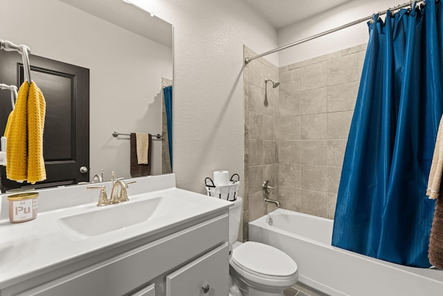 bathroom with toilet, shower / bath combo, and vanity