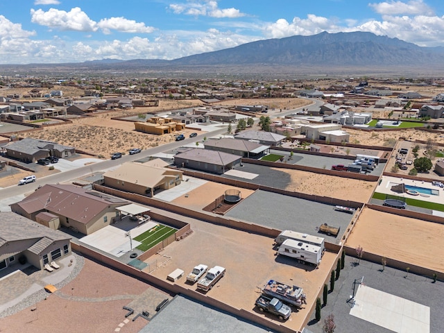 drone / aerial view featuring a mountain view and a residential view