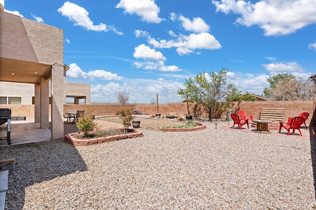10532 Box Canyon Pl NW, Albuquerque, NM 87114 - fenced backyard featuring an outdoor fire pit and a patio