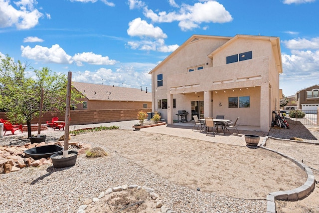 10532 Box Canyon Pl NW, Albuquerque, NM 87114 - rear view of house with a fenced backyard, stucco siding, and a patio
