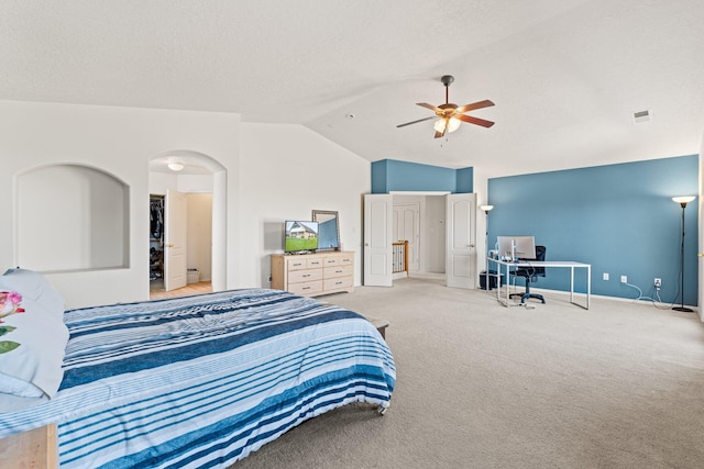 10532 Box Canyon Pl NW, Albuquerque, NM 87114 - carpeted bedroom featuring lofted ceiling, an office area, a ceiling fan, arched walkways, and baseboards