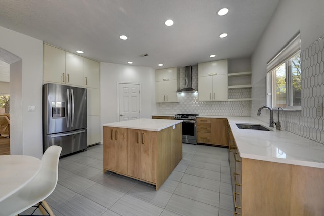 1807 Avenida Comunidad, Rio Rancho, NM 87124 - kitchen featuring appliances with stainless steel finishes, a sink, wall chimney exhaust hood, open shelves, and backsplash