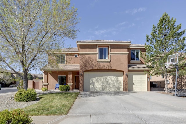 1807 Avenida Comunidad, Rio Rancho, NM 87124 - view of front of property featuring an attached garage, stucco siding, concrete driveway, and a tile roof