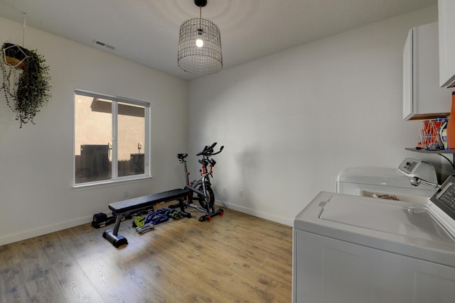 1807 Avenida Comunidad, Rio Rancho, NM 87124 - exercise area with washer and dryer, light wood finished floors, and baseboards