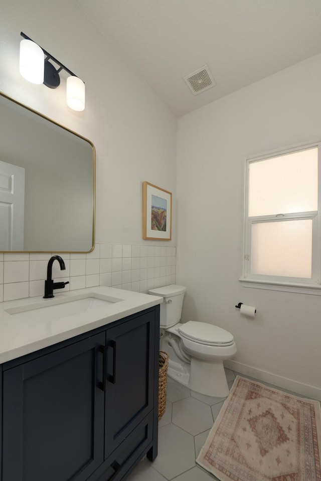 1807 Avenida Comunidad, Rio Rancho, NM 87124 - bathroom featuring vanity, toilet, tile patterned floors, and tasteful backsplash