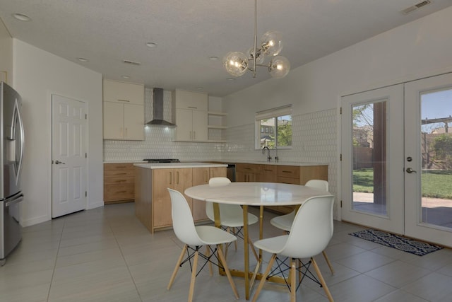 1807 Avenida Comunidad, Rio Rancho, NM 87124 - dining space featuring french doors, a chandelier, and light tile patterned floors