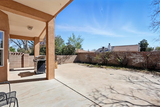 9712 Monteria Ct NW, Albuquerque, NM 87114 - fenced backyard featuring a grill and a patio