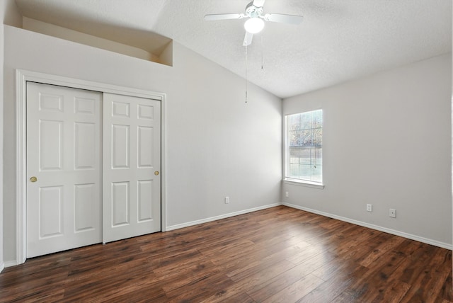 9712 Monteria Ct NW, Albuquerque, NM 87114 - unfurnished bedroom with lofted ceiling, dark wood-style flooring, a closet, a textured ceiling, and ceiling fan