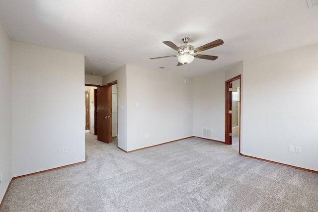 1647 Atrisco Dr SW, Albuquerque, NM 87105 - spare room with light colored carpet, a ceiling fan, and baseboards