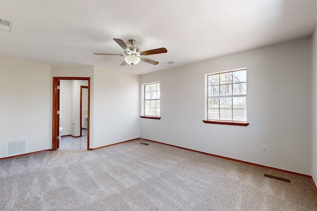 1647 Atrisco Dr SW, Albuquerque, NM 87105 - carpeted empty room featuring baseboards, a ceiling fan, and a textured ceiling