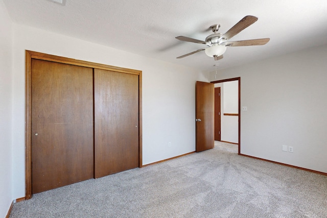 1647 Atrisco Dr SW, Albuquerque, NM 87105 - unfurnished bedroom featuring light carpet, a closet, baseboards, and a ceiling fan