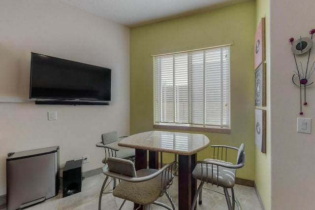 dining area featuring baseboards