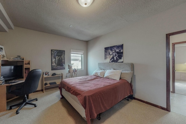 bedroom featuring baseboards, light colored carpet, and a textured ceiling