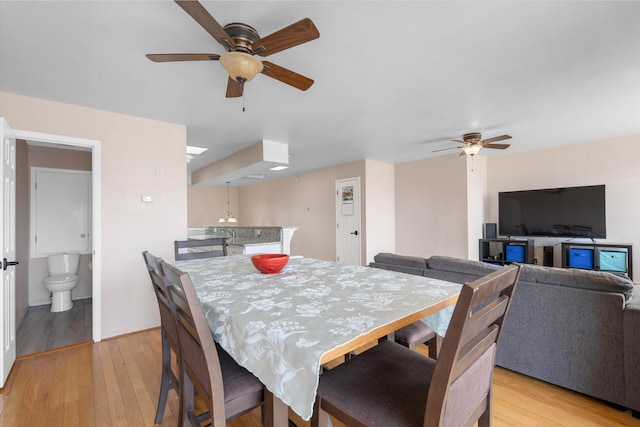 2700 Vista Grande Dr NW Unit 56, Albuquerque, NM 87120 - dining space featuring light wood-style flooring and ceiling fan