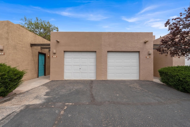2700 Vista Grande Dr NW Unit 56, Albuquerque, NM 87120 - garage with aphalt driveway