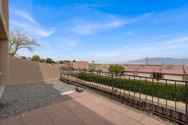 2700 Vista Grande Dr NW Unit 56, Albuquerque, NM 87120 - view of patio with a mountain view and a balcony