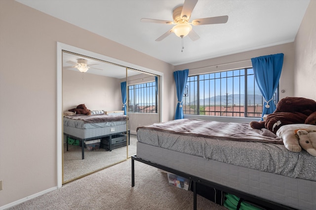 2700 Vista Grande Dr NW Unit 56, Albuquerque, NM 87120 - bedroom with carpet, a closet, baseboards, and ceiling fan