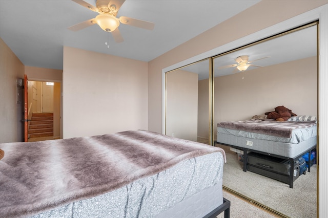 2700 Vista Grande Dr NW Unit 56, Albuquerque, NM 87120 - carpeted bedroom featuring a closet and ceiling fan