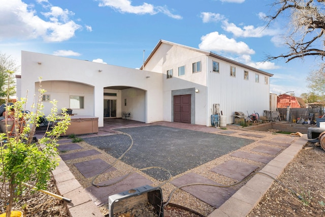 2912 William St SE, Albuquerque, NM 87102 - view of front of house featuring a patio area, a hot tub, and stucco siding