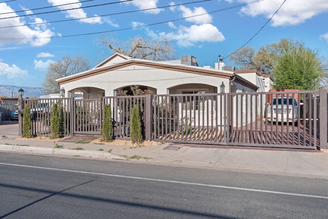 2912 William St SE, Albuquerque, NM 87102 - view of front of property featuring a chimney, a gate, and a fenced front yard