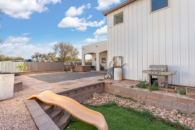 2912 William St SE, Albuquerque, NM 87102 - exterior space with a fenced backyard, a hot tub, a patio area, and a playground