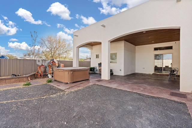 2912 William St SE, Albuquerque, NM 87102 - view of patio featuring a fenced backyard and a hot tub