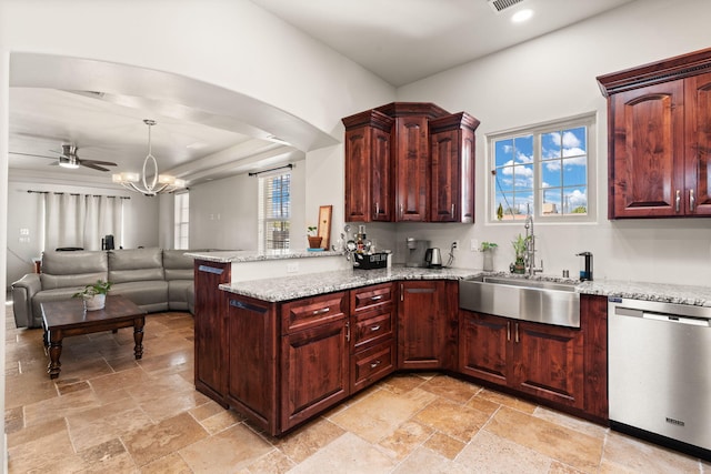 2912 William St SE, Albuquerque, NM 87102 - kitchen featuring dishwasher, a peninsula, stone tile flooring, and a sink