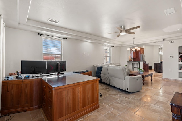 2912 William St SE, Albuquerque, NM 87102 - office featuring visible vents, a tray ceiling, stone tile flooring, and ceiling fan with notable chandelier