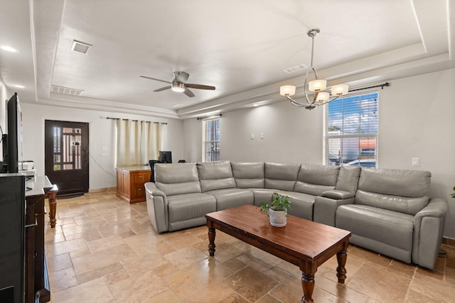 2912 William St SE, Albuquerque, NM 87102 - living room featuring a raised ceiling, stone tile floors, and visible vents