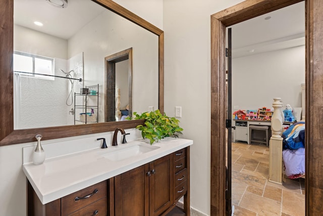 2912 William St SE, Albuquerque, NM 87102 - bathroom featuring stone tile flooring and vanity