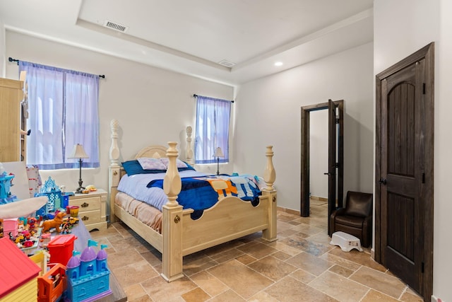 2912 William St SE, Albuquerque, NM 87102 - bedroom with stone tile floors, baseboards, visible vents, recessed lighting, and a raised ceiling