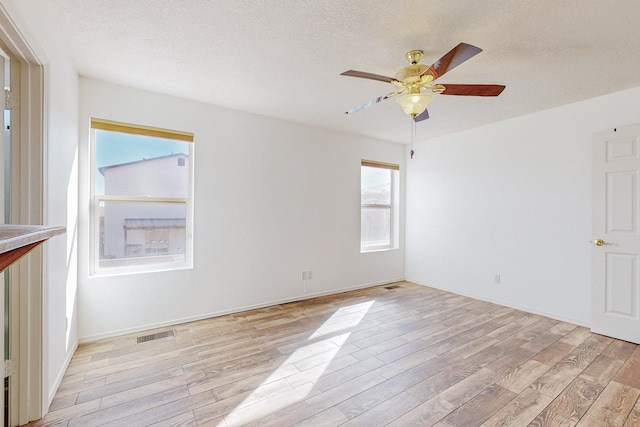 2740 Wilder Loop NE, Rio Rancho, NM 87144 - unfurnished room featuring baseboards, visible vents, light wood-type flooring, and a ceiling fan