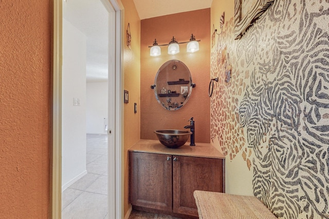 2740 Wilder Loop NE, Rio Rancho, NM 87144 - bathroom with tile patterned floors, a textured wall, and vanity