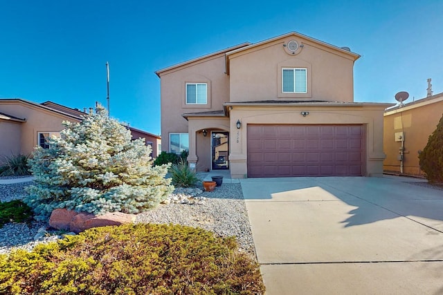 2740 Wilder Loop NE, Rio Rancho, NM 87144 - mediterranean / spanish home with an attached garage, concrete driveway, and stucco siding
