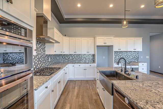 4621 27th Ave NE, Rio Rancho, NM 87144 - kitchen with stainless steel appliances, dark wood-style floors, a sink, white cabinetry, and recessed lighting