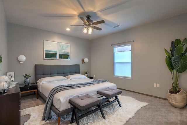 4621 27th Ave NE, Rio Rancho, NM 87144 - bedroom with light carpet, baseboards, and a ceiling fan