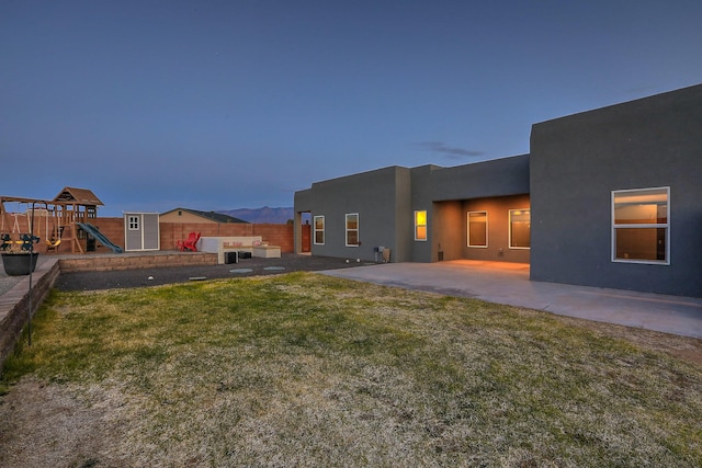 4621 27th Ave NE, Rio Rancho, NM 87144 - view of yard with a playground and a patio area
