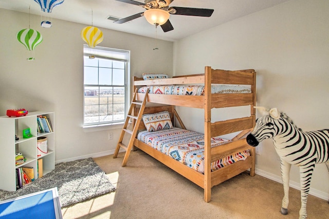 carpeted bedroom with visible vents and baseboards