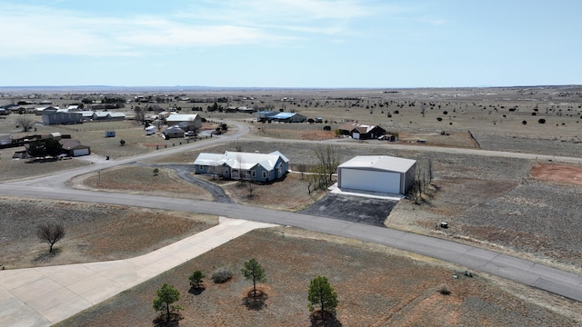 birds eye view of property featuring a rural view