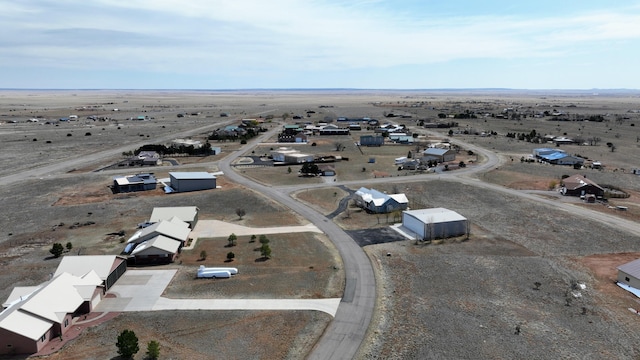 birds eye view of property featuring a desert view