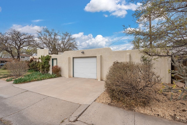 exterior space with concrete driveway