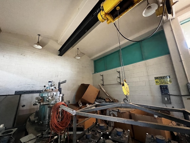misc room featuring concrete block wall