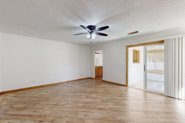 8021 Ruidoso Ct NE, Albuquerque, NM 87109 - spare room with visible vents, baseboards, light wood-style flooring, a textured ceiling, and ceiling fan