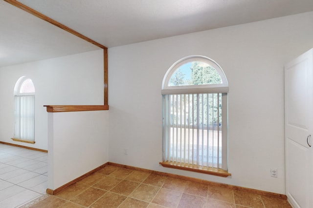 8021 Ruidoso Ct NE, Albuquerque, NM 87109 - tiled spare room featuring baseboards