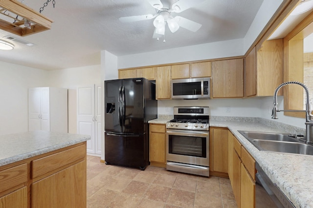 8021 Ruidoso Ct NE, Albuquerque, NM 87109 - kitchen with ceiling fan, stainless steel appliances, light countertops, and a sink