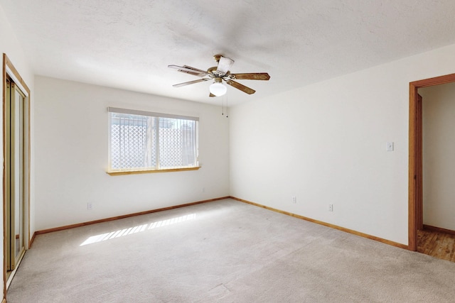 8021 Ruidoso Ct NE, Albuquerque, NM 87109 - unfurnished bedroom featuring a ceiling fan, baseboards, a closet, and light colored carpet