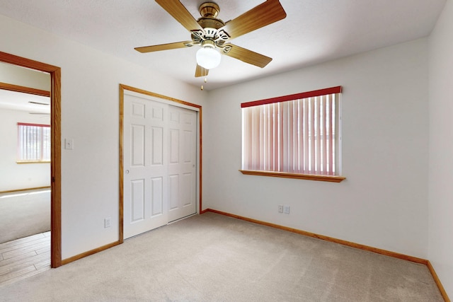 8021 Ruidoso Ct NE, Albuquerque, NM 87109 - unfurnished bedroom featuring a ceiling fan, baseboards, carpet, and a closet