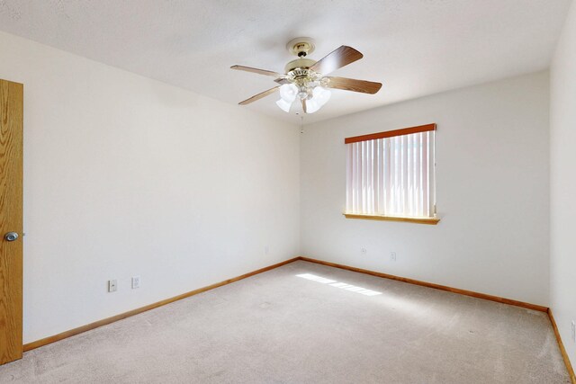 8021 Ruidoso Ct NE, Albuquerque, NM 87109 - spare room featuring baseboards, carpet, and ceiling fan