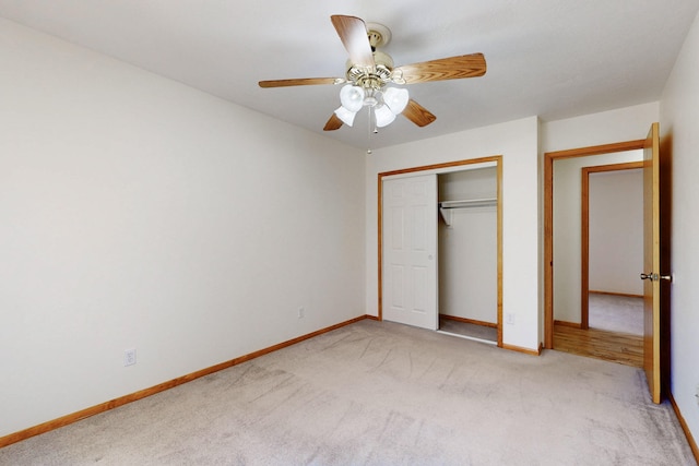 8021 Ruidoso Ct NE, Albuquerque, NM 87109 - unfurnished bedroom with light carpet, a ceiling fan, baseboards, and a closet